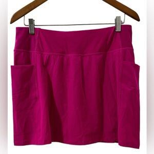Spyder fuschia tennis or golf skort with side pockets and shorts. 15”